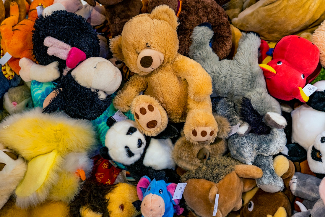 a pile of stuffed animals sitting next to each other
