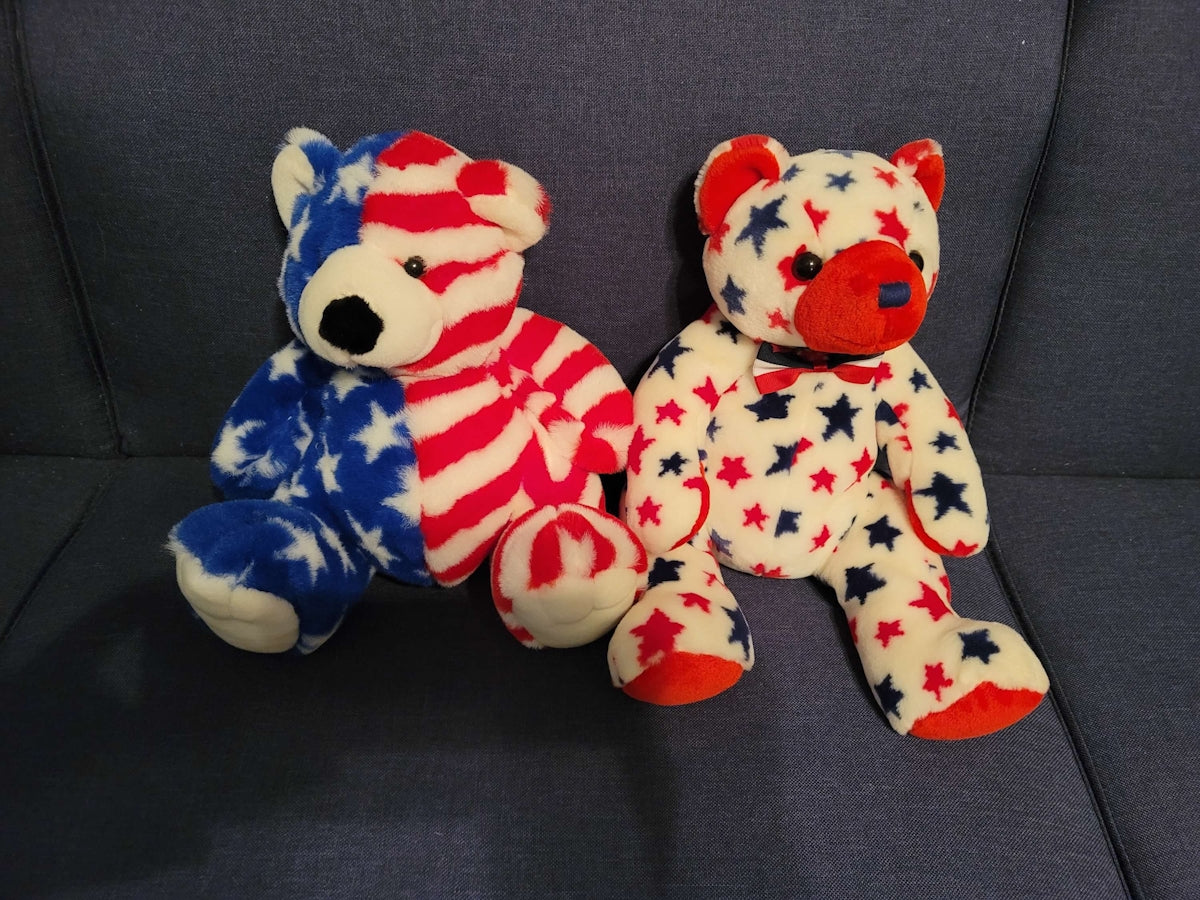 a couple of stuffed animals sitting on top of a couch