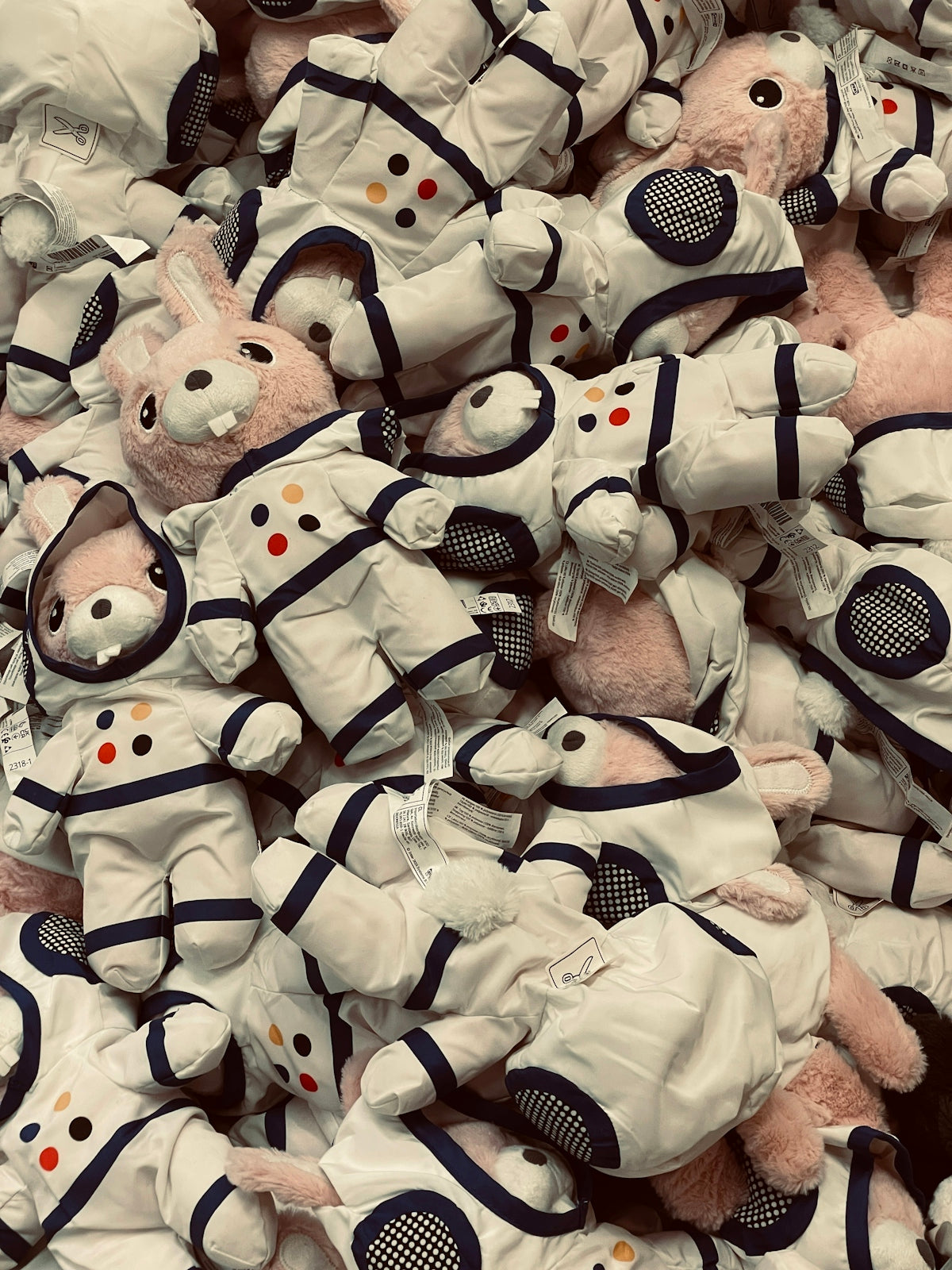 Bunny plushies wearing astronaut suits fill the frame
